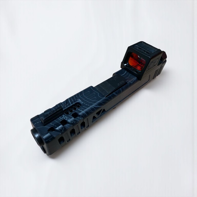 Blue machined pistol slide with optic