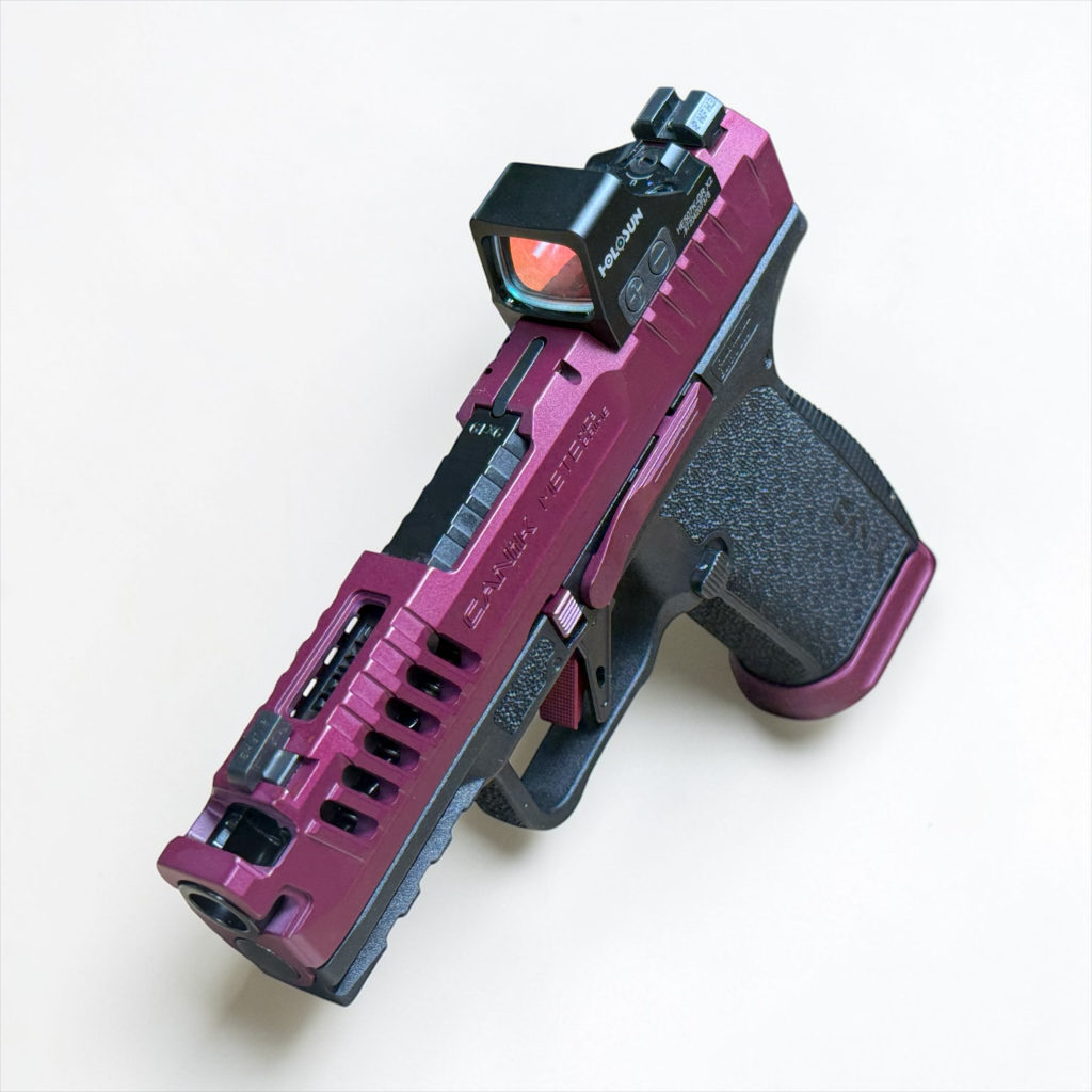 Magenta and black custom pistol with optic